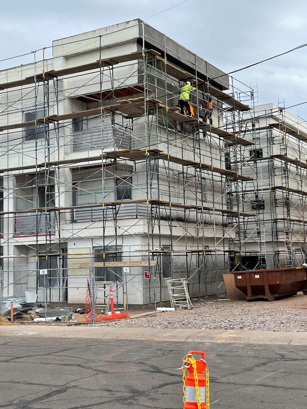 Modern townhome exterior with stucco finish and balconies